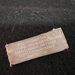 Men’s silk double faced scarf 🧣 Silk Care Label on Black Garment